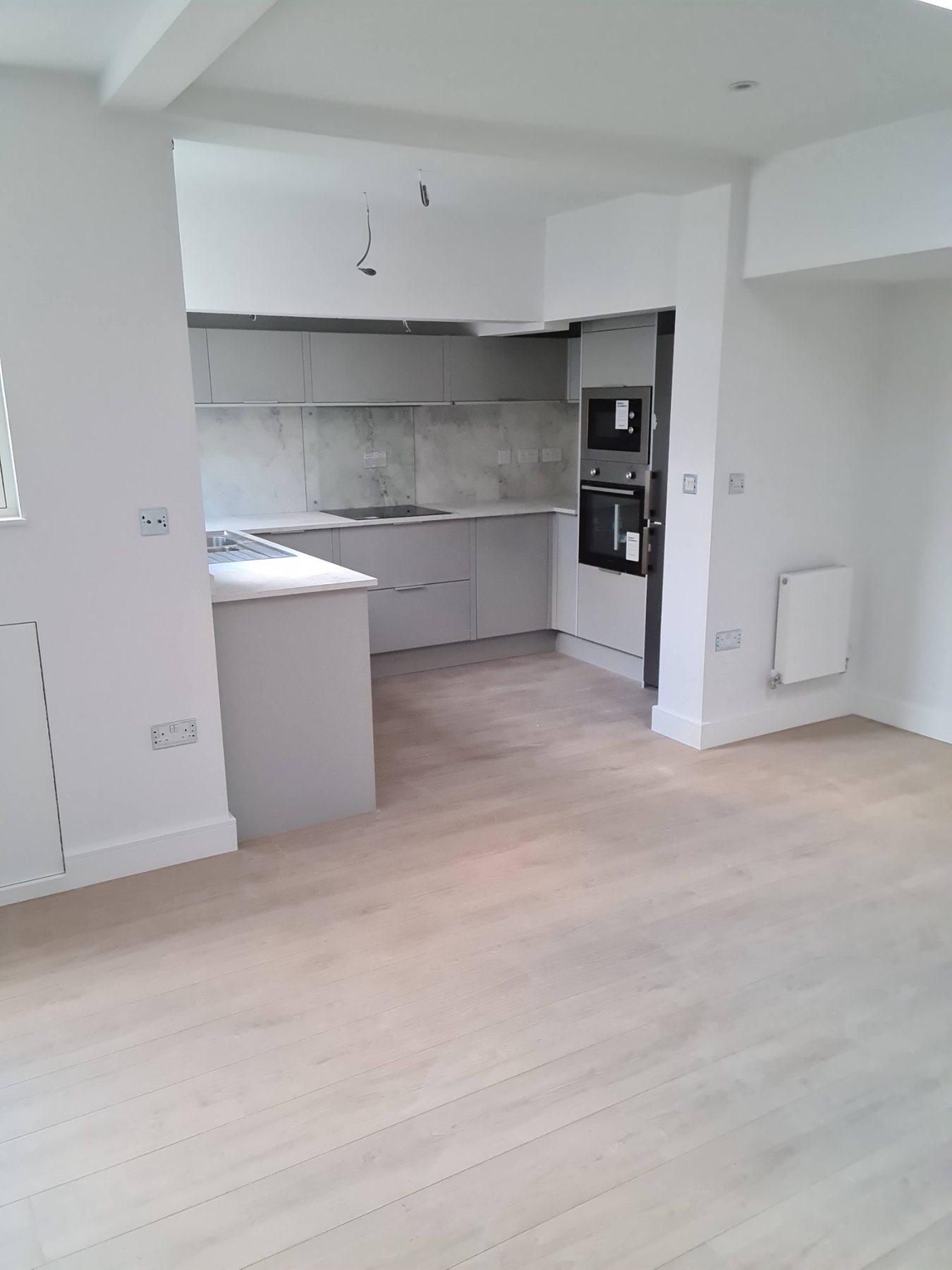 Open-plan fitted kitchen and living space