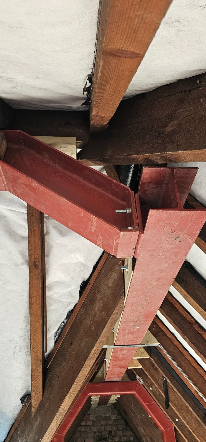 Detailed bolted structural steel connection within the roof frame