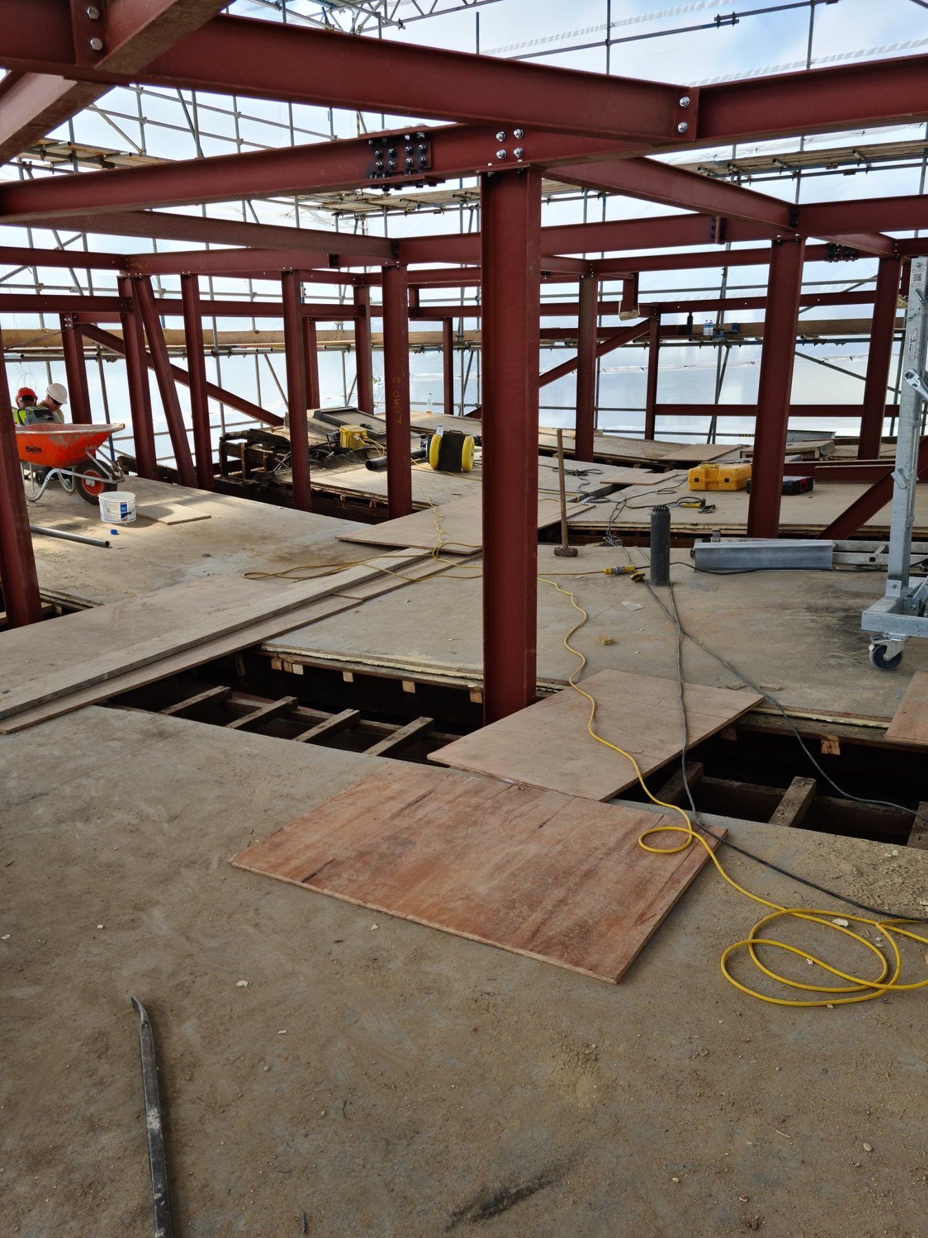 Structural steel frame installed across multiple floor levels